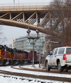 AVR 3003 SD40-3 leads the AVR Bakerstown turn (running as CSXT Z401-06) past the ancient B&O color position light signals at East Schenley, while a CSXT Trainmaster looks on from his Chevy Hy-rail truck.  January 6, 2014